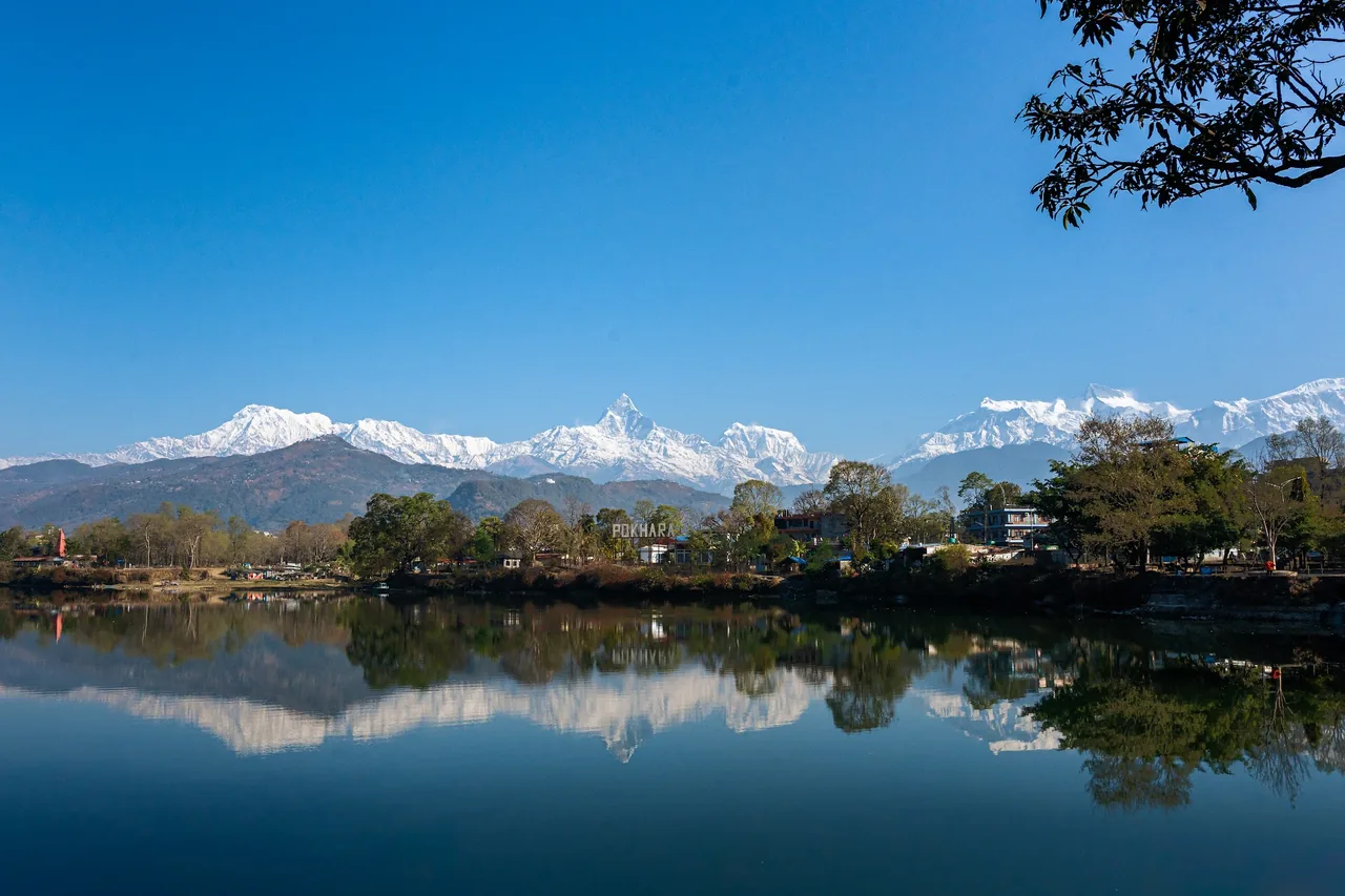 The Annapurna range reflected in Begnas Lake, Pokhara
